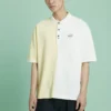 Converse Herren-Poloshirt mit Splicing-Colorblock-Revers und kurzen Ärmeln in Creme-Gelb
